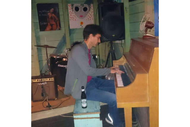 guest photo playing piano belize